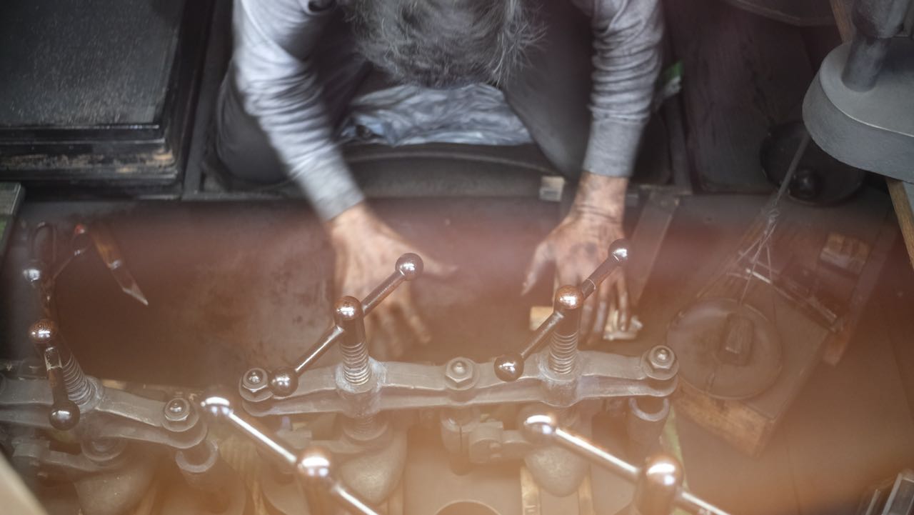 man rolling sumi paste